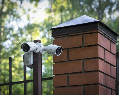 CSI Security professional installing a CCTV surveillance camera system.